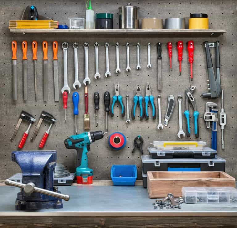 garage workspace with tools on a pegboard