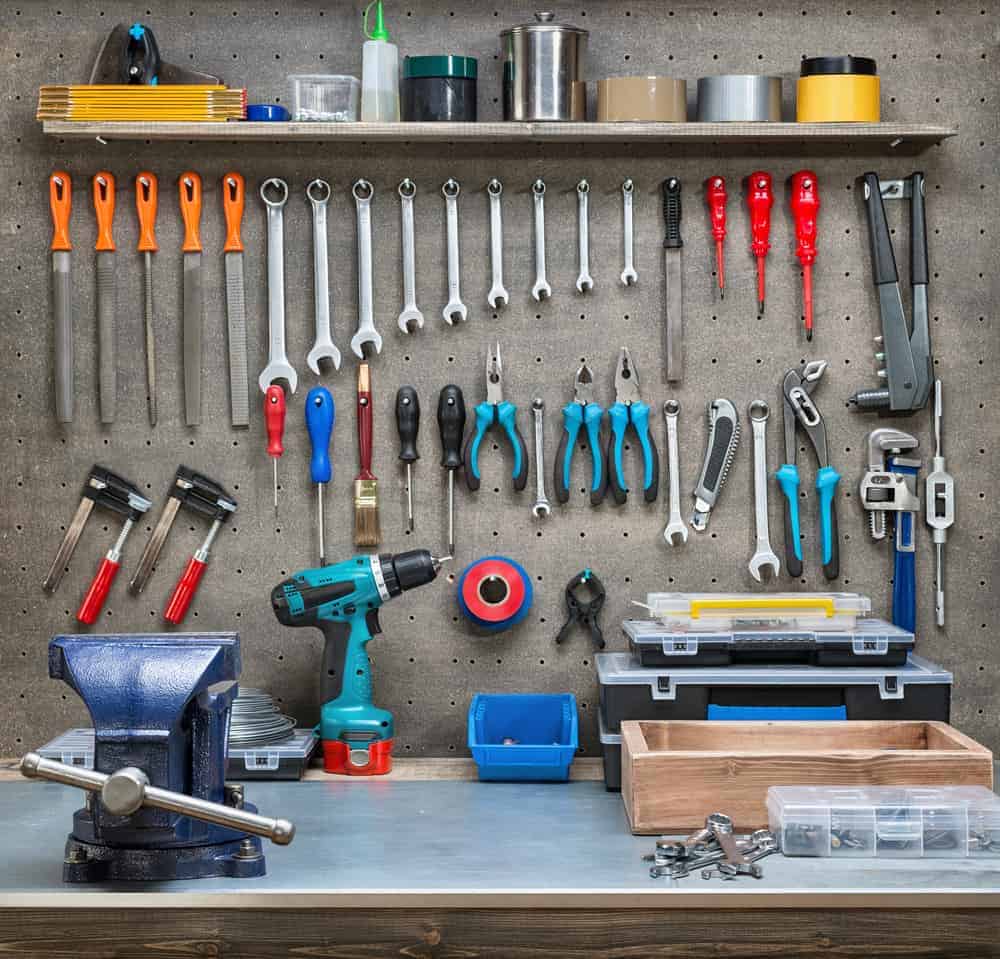 garage workspace with tools on a pegboard